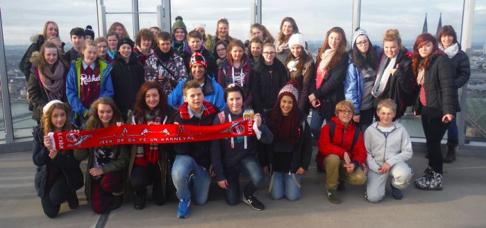 School group holding Cologne scarf