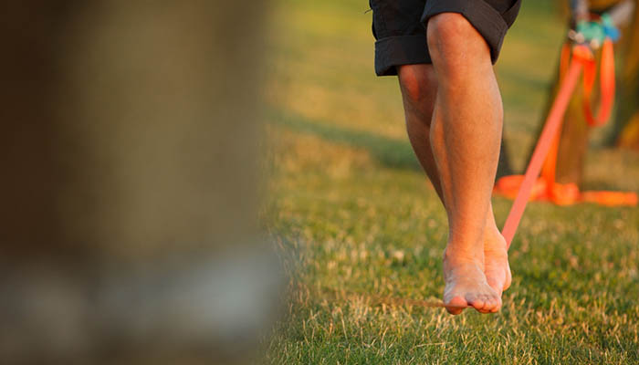 A,Barefoot,Person,Walking,On,A,Slackline,,Slacklining,In,The